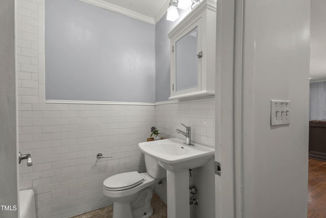 334 Westview Dr, Fayetteville, NC 28303 - bathroom with ornamental molding, tile walls, toilet, and wainscoting