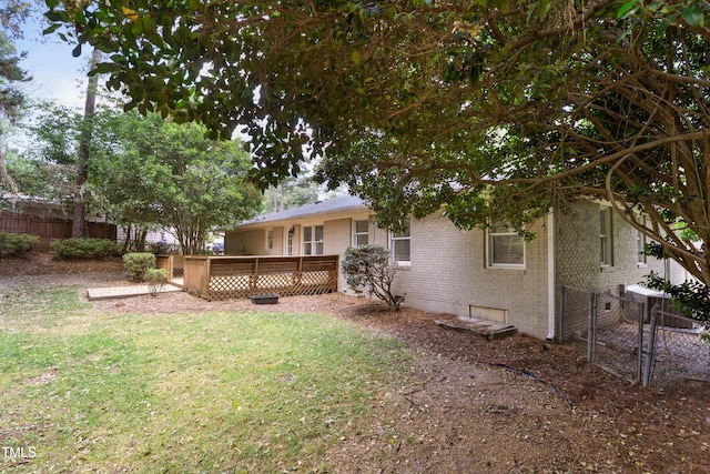 334 Westview Dr, Fayetteville, NC 28303 - rear view of house featuring brick siding, a wooden deck, and crawl space