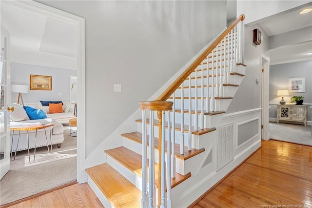 staircase featuring hardwood / wood-style flooring