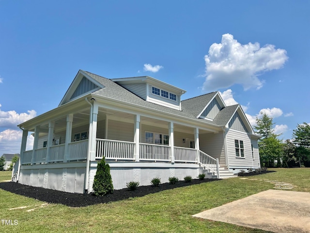 4016 Berman Edge Rd, Holly Springs, NC 27540 - view of front of home featuring covered porch, a front yard, board and batten siding, and roof with shingles