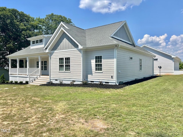 4016 Berman Edge Rd, Holly Springs, NC 27540 - view of front of house with board and batten siding, a porch, crawl space, a front yard, and a shingled roof
