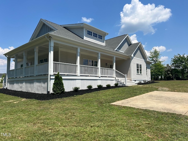 4016 Berman Edge Rd, Holly Springs, NC 27540 - view of front of house featuring board and batten siding, a front yard, and a porch
