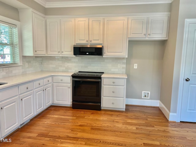 4016 Berman Edge Rd, Holly Springs, NC 27540 - kitchen featuring black electric range, white cabinetry, decorative backsplash, light wood finished floors, and light countertops