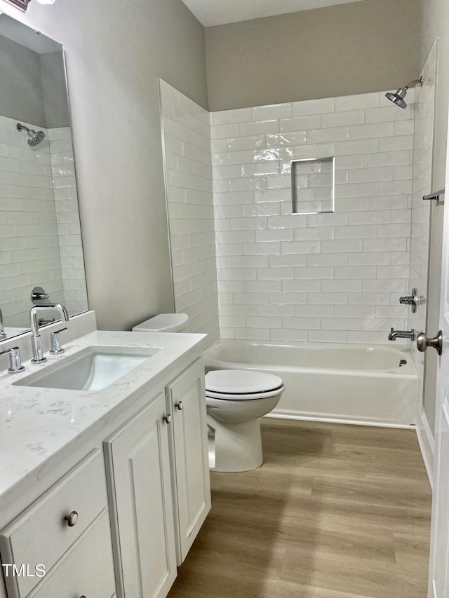 4016 Berman Edge Rd, Holly Springs, NC 27540 - full bath with toilet, wood finished floors, bathtub / shower combination, and vanity