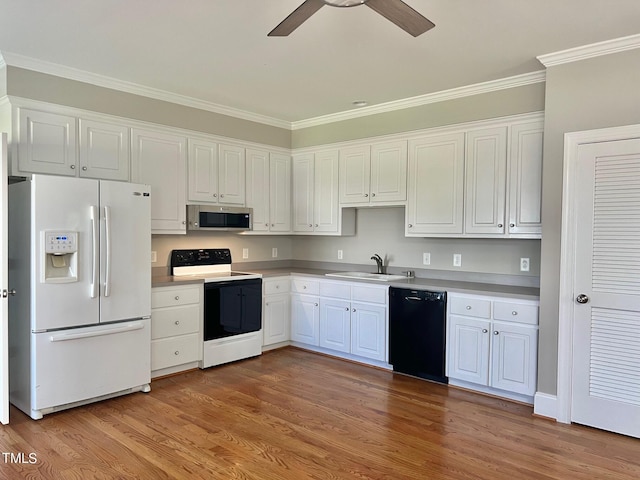 4016 Berman Edge Rd, Holly Springs, NC 27540 - kitchen with white fridge with ice dispenser, electric range, black dishwasher, stainless steel microwave, and ceiling fan