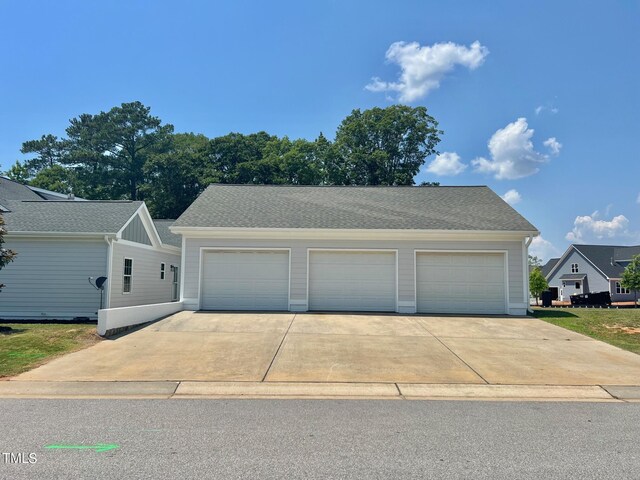 4016 Berman Edge Rd, Holly Springs, NC 27540 - view of front of property featuring an outdoor structure and roof with shingles
