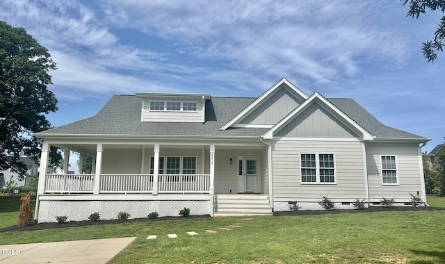 4016 Berman Edge Rd, Holly Springs, NC 27540 - view of front of house featuring covered porch, a front yard, roof with shingles, and board and batten siding