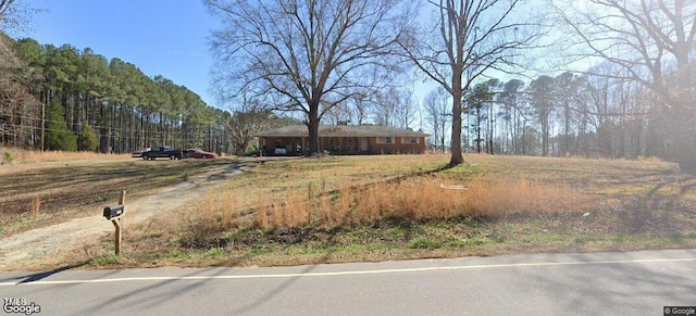 8401 Humie Olive Rd, Apex, NC 27502 - view of yard with a wooded view