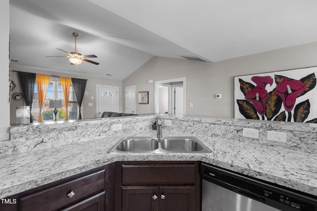kitchen featuring dishwasher, a sink, light countertops, dark brown cabinets, and vaulted ceiling