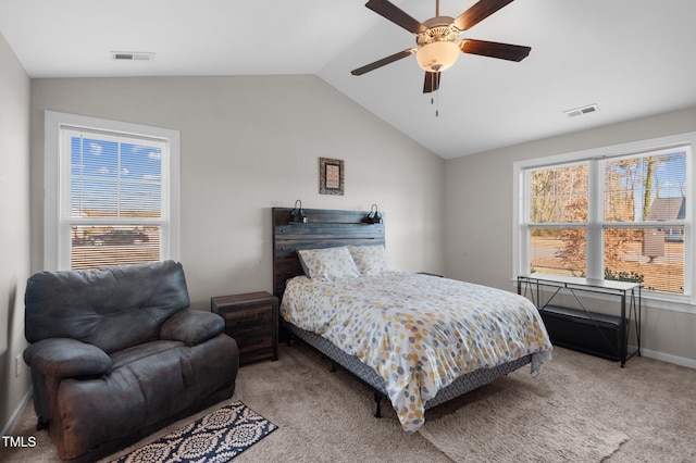 carpeted bedroom with vaulted ceiling, multiple windows, baseboards, and ceiling fan