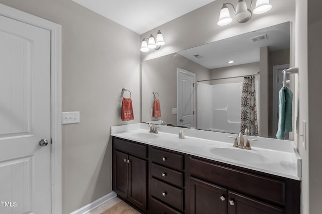 full bathroom with double vanity, a shower with curtain, and baseboards