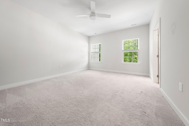 1437 Newpoint Dr, Durham, NC 27713 - spare room with light carpet, ceiling fan, and baseboards