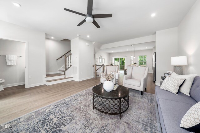 1437 Newpoint Dr, Durham, NC 27713 - living room with wood finished floors, ceiling fan, recessed lighting, stairway, and baseboards