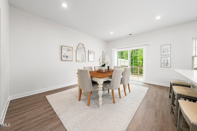 1437 Newpoint Dr, Durham, NC 27713 - dining room with dark wood-type flooring, baseboards, and recessed lighting