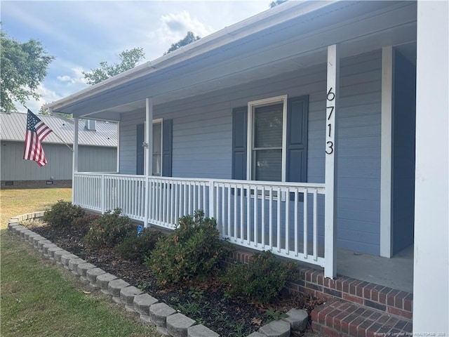 view of side of property with a porch