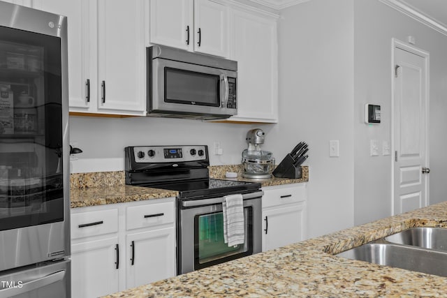 100 Stratford Lakes Dr Unit 361, Durham, NC 27713 - kitchen with stainless steel appliances, white cabinets, light stone counters, a sink, and crown molding