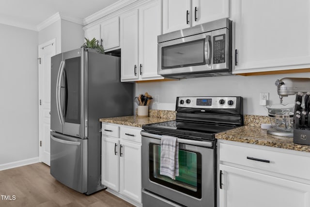 100 Stratford Lakes Dr Unit 361, Durham, NC 27713 - kitchen featuring stainless steel appliances, ornamental molding, light wood-style flooring, dark stone countertops, and white cabinetry