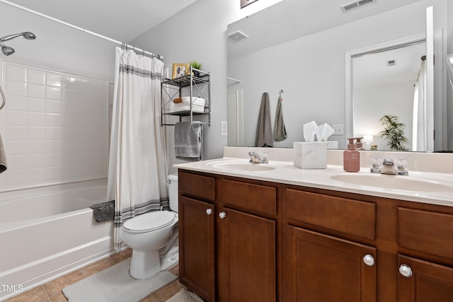 100 Stratford Lakes Dr Unit 361, Durham, NC 27713 - bathroom with toilet, double vanity, tile patterned floors, and shower / tub combo with curtain