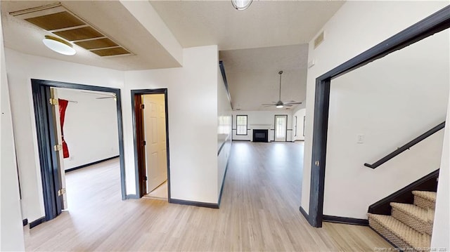 2500 Forest Lodge Dr, Fayetteville, NC 28306 - hallway with light wood finished floors, baseboards, and stairs