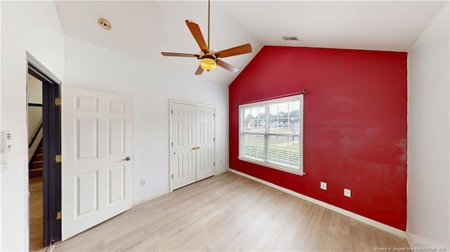 2500 Forest Lodge Dr, Fayetteville, NC 28306 - unfurnished bedroom featuring wood finished floors, vaulted ceiling, baseboards, a ceiling fan, and a closet