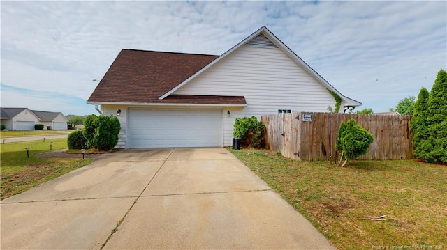 2500 Forest Lodge Dr, Fayetteville, NC 28306 - view of home's exterior with concrete driveway and an attached garage