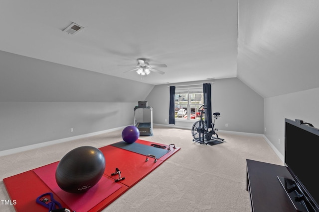 workout room featuring lofted ceiling, ceiling fan, carpet flooring, and baseboards