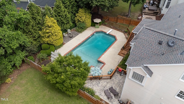 view of subject property featuring a pool area