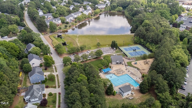 view of property location with a large body of water and a pool area