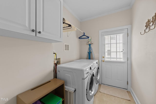 laundry room with separate washer and dryer, cabinet space, ornamental molding, light tile patterned flooring, and baseboards