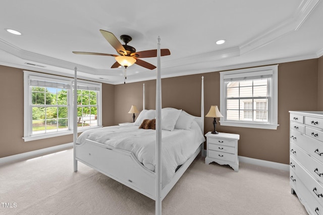 bedroom featuring a raised ceiling, ornamental molding, light colored carpet, baseboards, and recessed lighting