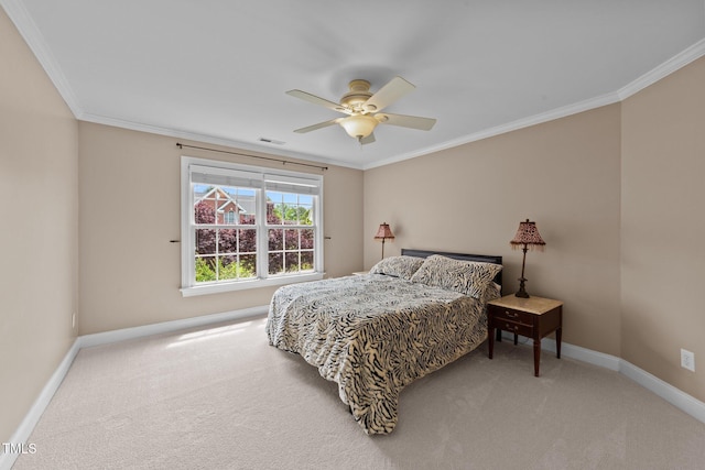bedroom with baseboards, carpet flooring, crown molding, and a ceiling fan