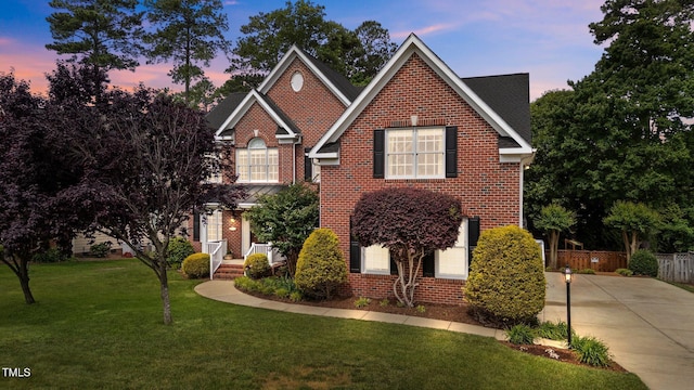traditional-style home featuring brick siding