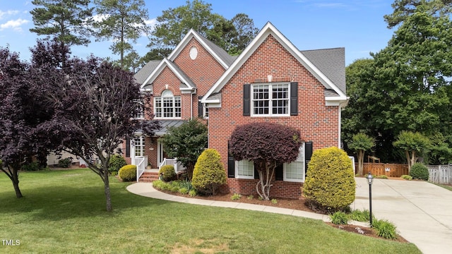 traditional-style home with brick siding