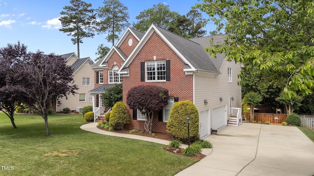 traditional-style house with driveway, an attached garage, brick siding, and roof with shingles