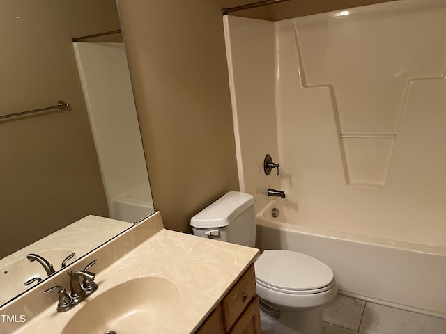 full bath with toilet, vanity, tub / shower combination, and marble finish floors