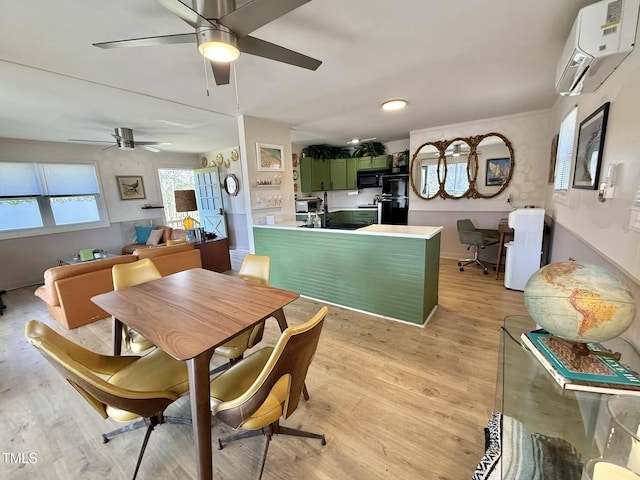 dining area featuring a wall mounted AC, an office area, a ceiling fan, and light wood-type flooring