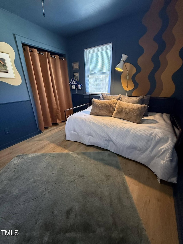 bedroom featuring wood finished floors
