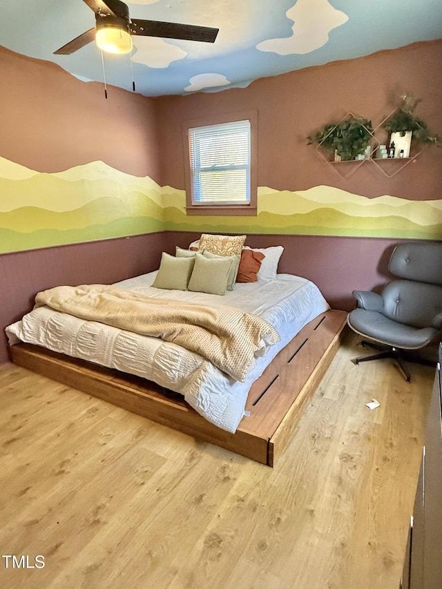 bedroom with wood finished floors and ceiling fan