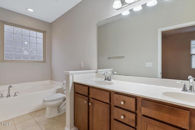 full bath featuring toilet, tile patterned floors, a bath, and double vanity