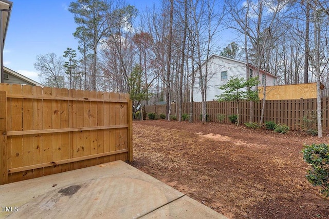 view of yard featuring a patio and fence