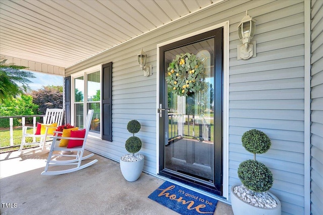 doorway to property featuring a porch