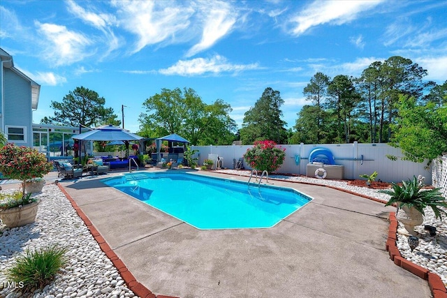 view of pool featuring a gazebo, a patio area, and a fenced backyard