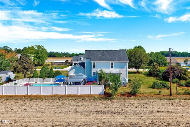 back of house featuring fence