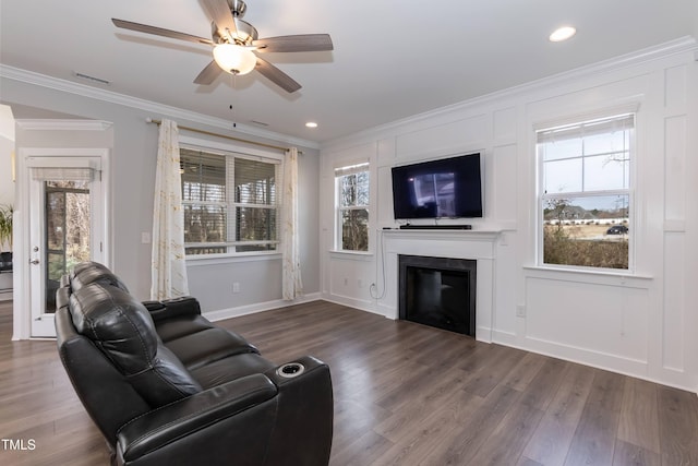 76 Freewill Pl, Raleigh, NC 27603 - living room with ornamental molding, a ceiling fan, wood finished floors, a fireplace, and baseboards