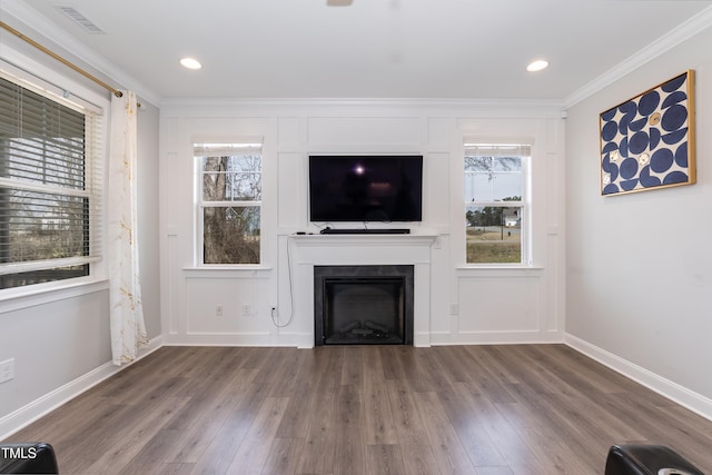 76 Freewill Pl, Raleigh, NC 27603 - unfurnished living room with a fireplace, wood finished floors, healthy amount of natural light, ornamental molding, and recessed lighting