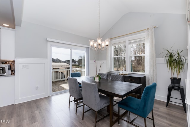 76 Freewill Pl, Raleigh, NC 27603 - dining room featuring a chandelier, vaulted ceiling, and wood finished floors