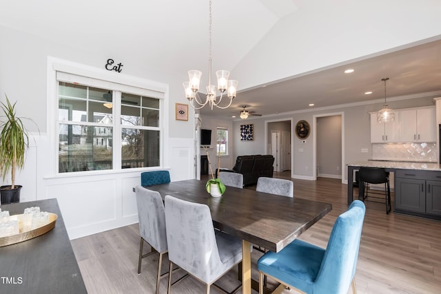 76 Freewill Pl, Raleigh, NC 27603 - dining space with a chandelier, lofted ceiling, light wood finished floors, recessed lighting, and ceiling fan