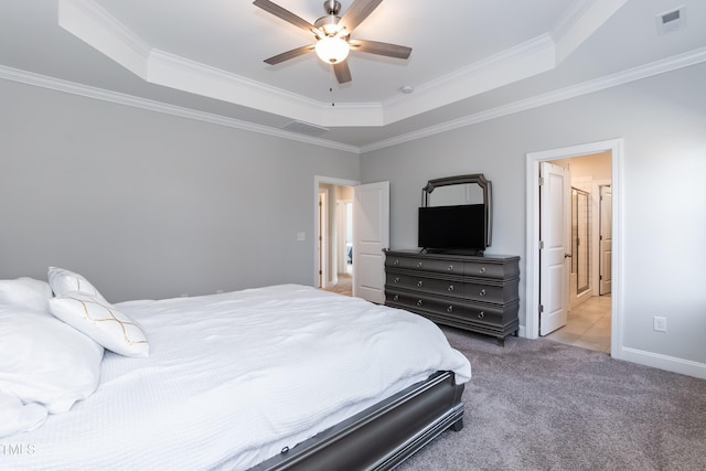 76 Freewill Pl, Raleigh, NC 27603 - carpeted bedroom featuring a raised ceiling, ornamental molding, a ceiling fan, and connected bathroom