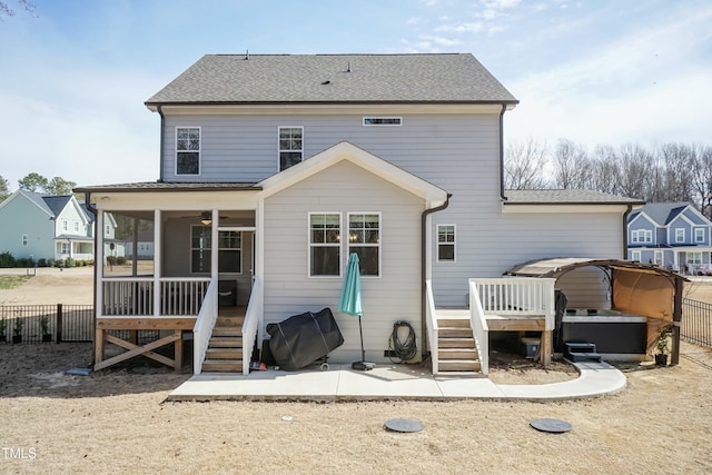 76 Freewill Pl, Raleigh, NC 27603 - rear view of property featuring a wooden deck, a sunroom, fence, stairway, and roof with shingles