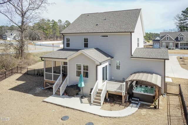 76 Freewill Pl, Raleigh, NC 27603 - back of house featuring a sunroom, a fenced backyard, roof with shingles, and a deck